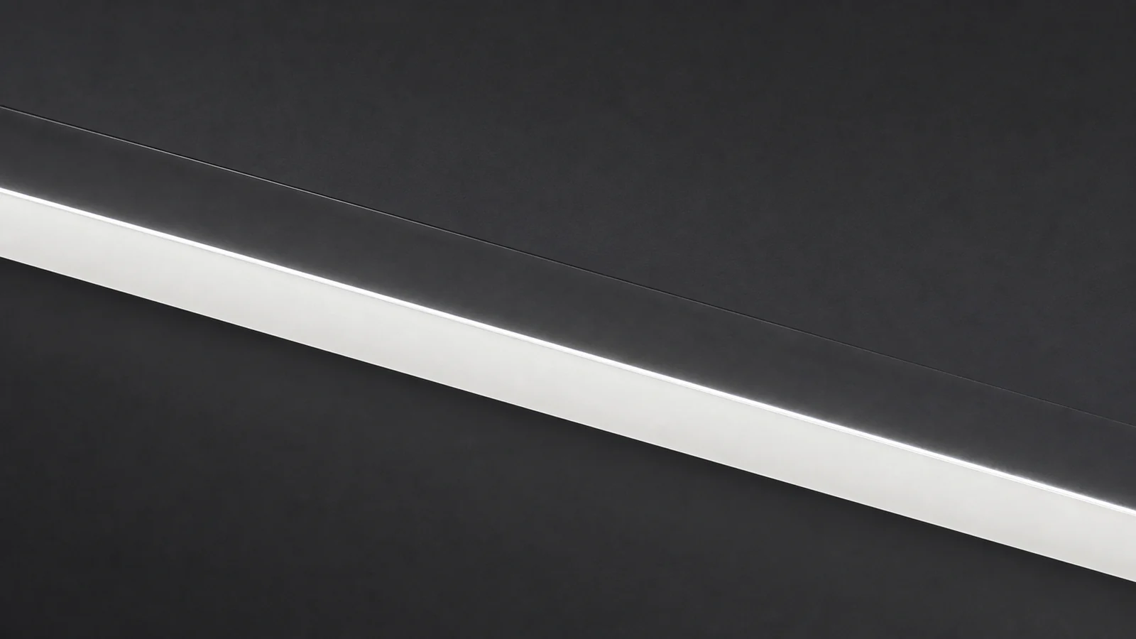 Close-up of the luminous layered edge of an FH Lighting frameless light guide panel